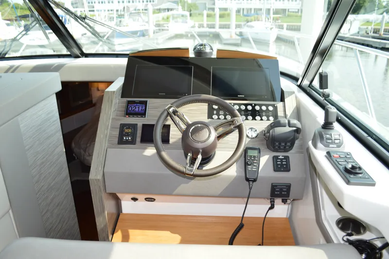 Slide: The Image of Helm of 2021 Tiara Yachts F44 Flybridge with modern navigation controls. - 20