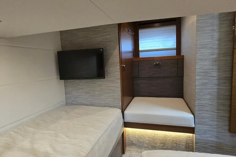 Slide: The Image of Interior cabin of 2021 Tiara Yachts F44 Flybridge with modern design and TV. - 32