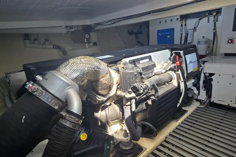 Slide: The Image of Engine room of 2021 Tiara Yachts F44 Flybridge, showcasing mechanical components and systems. - 53