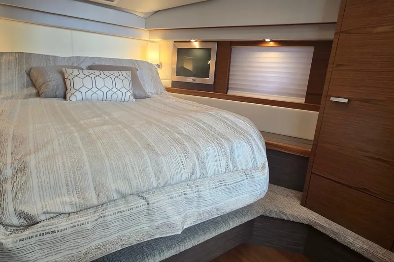 Slide: The Image of Luxurious bedroom interior of 2021 Tiara Yachts F44 Flybridge with modern decor and lighting. - 27