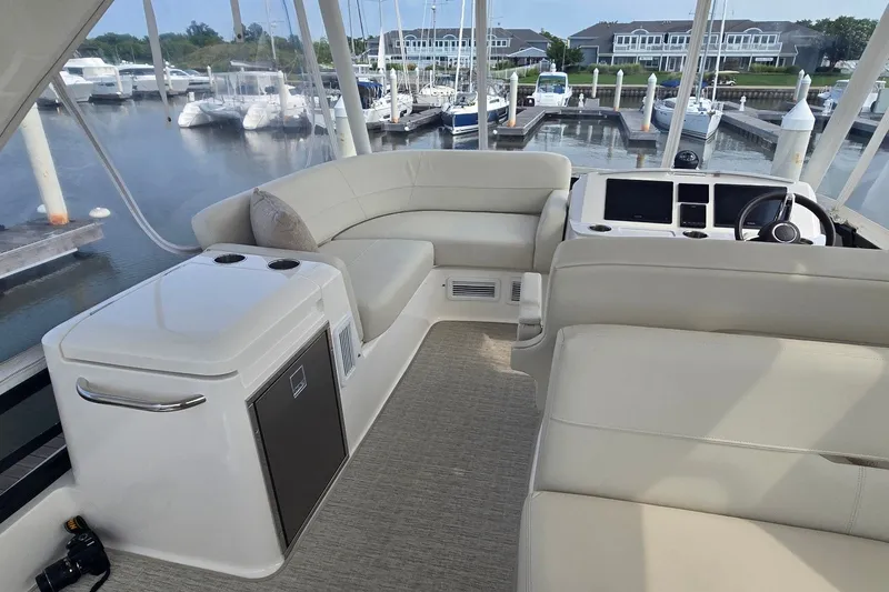 Slide: The Image of Luxurious 2021 Tiara Yachts F44 Flybridge interior with plush seating and modern helm. - 46