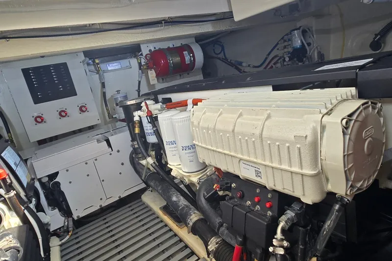Slide: The Image of Engine room of 2021 Tiara Yachts F44 Flybridge, featuring Volvo Penta components. - 54