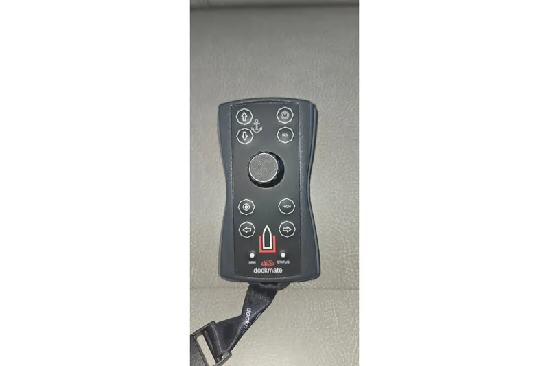 Slide: The Image of Remote control for 2021 Tiara Yachts F44 Flybridge, featuring various navigation buttons. - 61