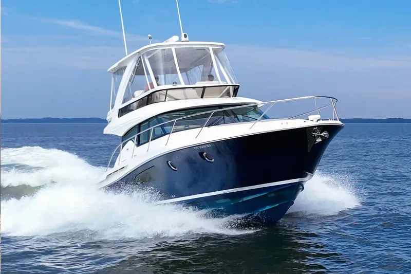 The Image of 2021 Tiara Yachts F44 Flybridge cruising on the water. - 0