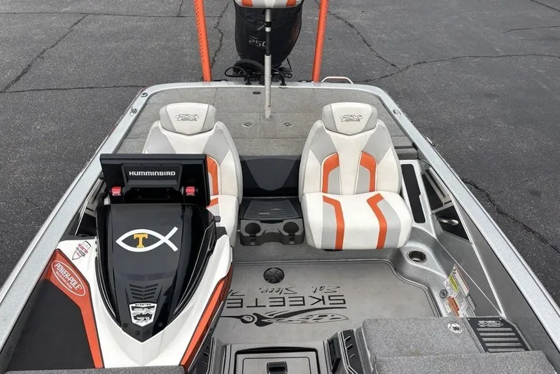 Slide: The Image of 2018 Skeeter FX21 boat interior with dual seats and Humminbird electronics. - 18