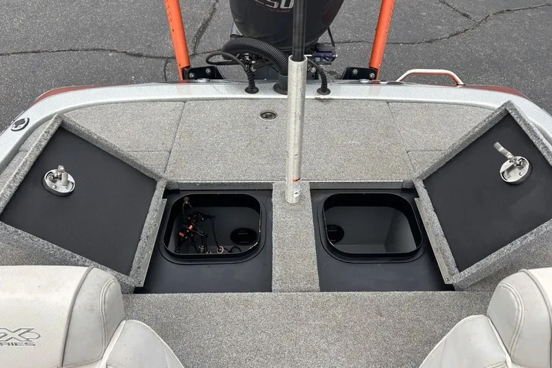 Slide: The Image of 2018 Skeeter FX21 boat deck with open storage compartments and seating. - 26