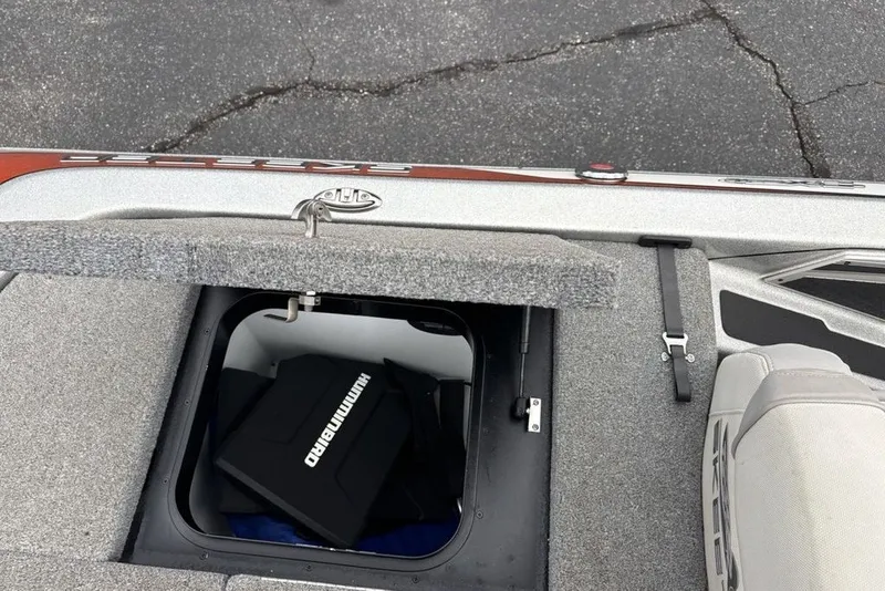 Slide: The Image of 2018 Skeeter FX21 boat storage compartment with Humminbird equipment inside. - 25