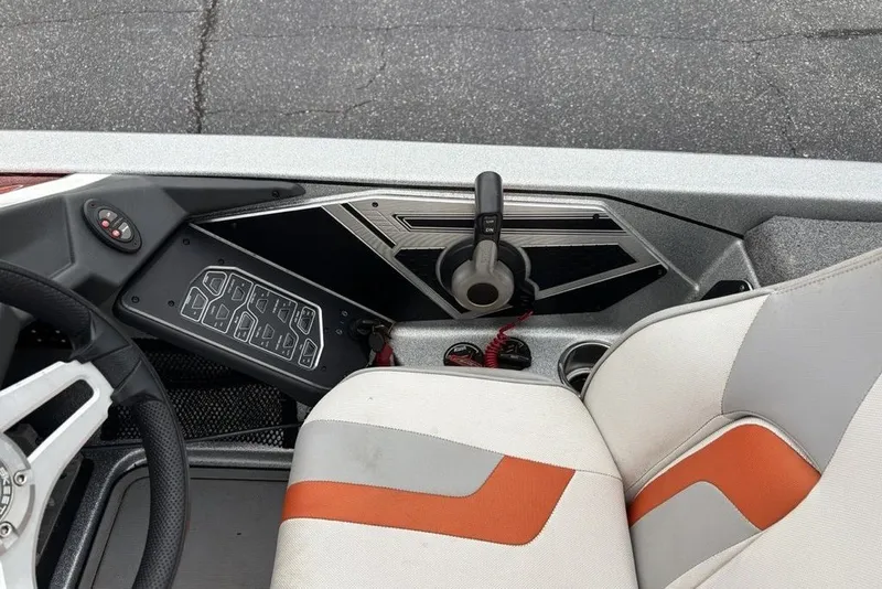 Slide: The Image of 2018 Skeeter FX21 boat interior with steering wheel and control panel. - 32