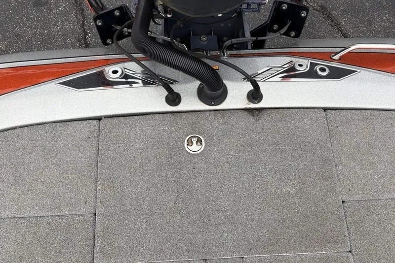 Slide: The Image of 2018 Skeeter FX21 boat deck with gray carpeting and control panel. - 27