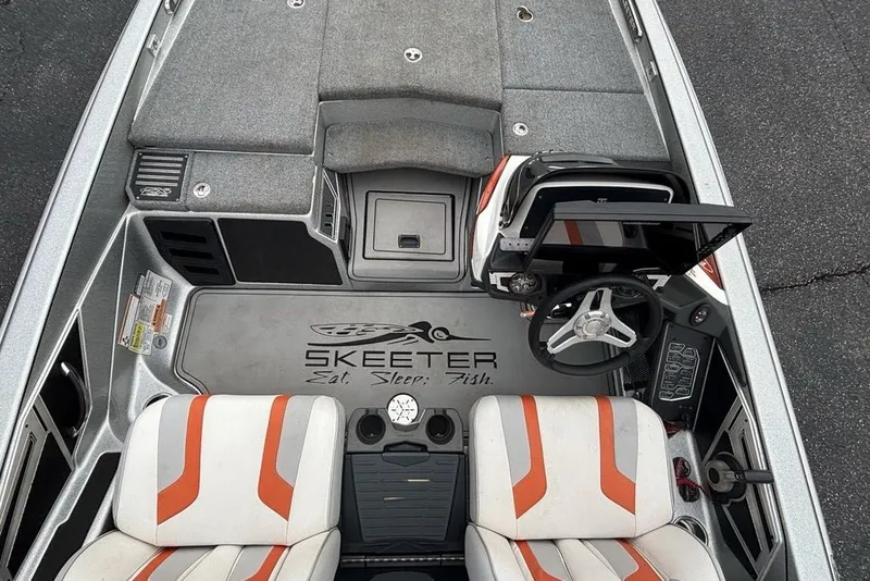 Slide: The Image of 2018 Skeeter FX21 boat interior with steering wheel, seats, and dashboard controls. - 34