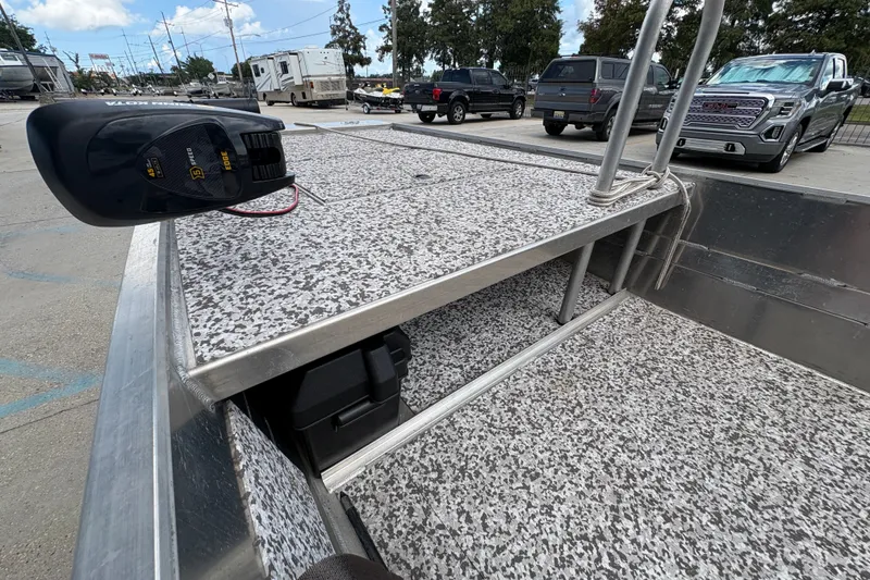 Slide: The Image of Aluminum boat deck with motor, parked in a lot, Custom model 14, 2023. - 17