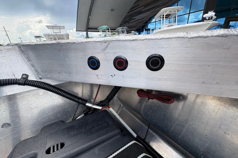 Slide: The Image of Aluminum boat interior with wiring and control buttons, Custom model 14, 2023. - 15
