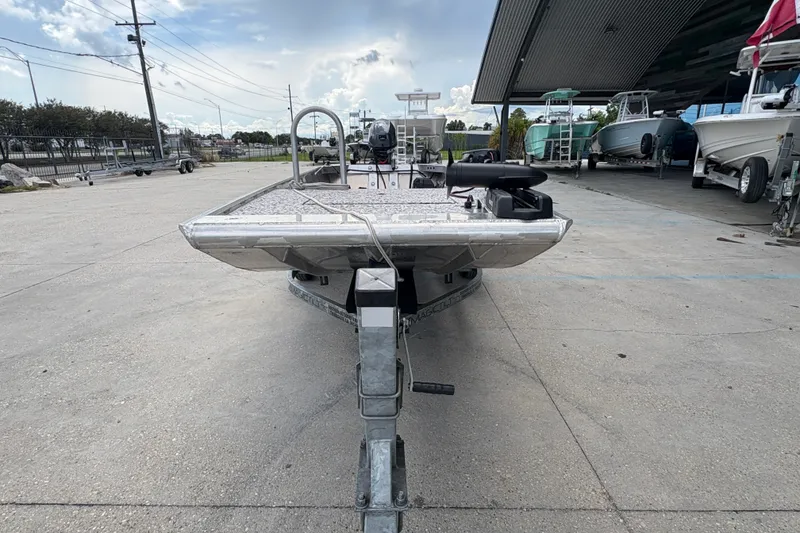 Slide: The Image of Custom 2023 model 14 boat on trailer in outdoor storage area. - 8