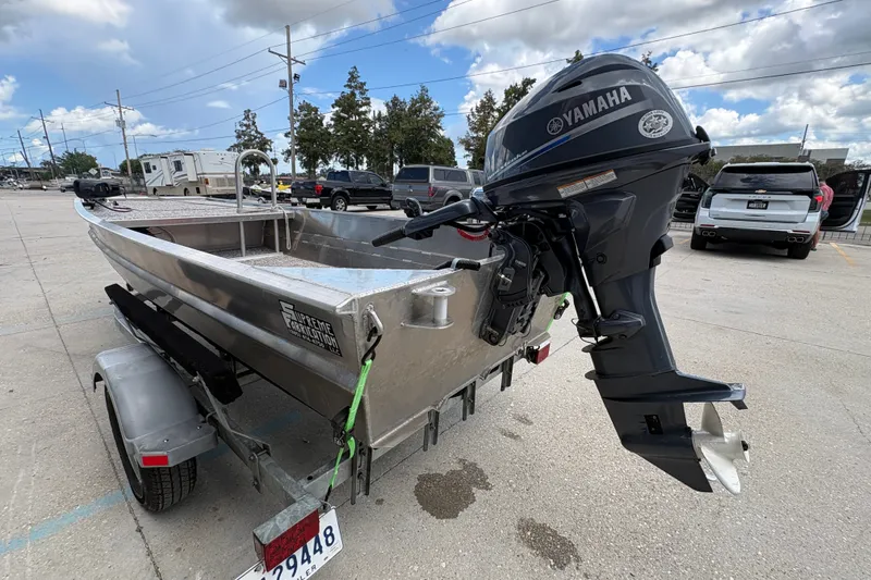 Slide: The Image of Custom 2023 aluminum boat with Yamaha outboard motor on trailer in parking lot. - 5