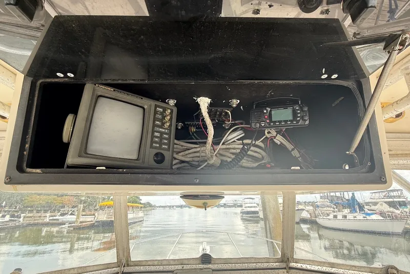 Slide: The Image of 2002 Carolina Classic 28 boat dashboard with navigation equipment and wiring. - 10