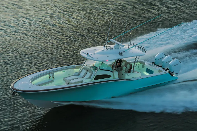 Slide: The Image of Manufacturer Provided Image: 2025 Mag Bay 38 CC boat cruising on water, featuring sleek design and powerful engines. - 2