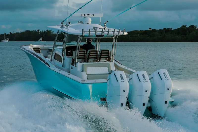 Slide: The Image of Manufacturer Provided Image: 2025 Mag Bay 38 CC boat with triple Mercury 400 engines cruising on water. - 3