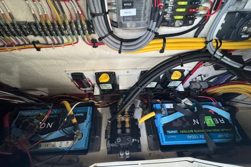 Slide: The Image of Electrical system of a 2022 Intrepid 345 Nomad SE boat with batteries and wiring. - 33