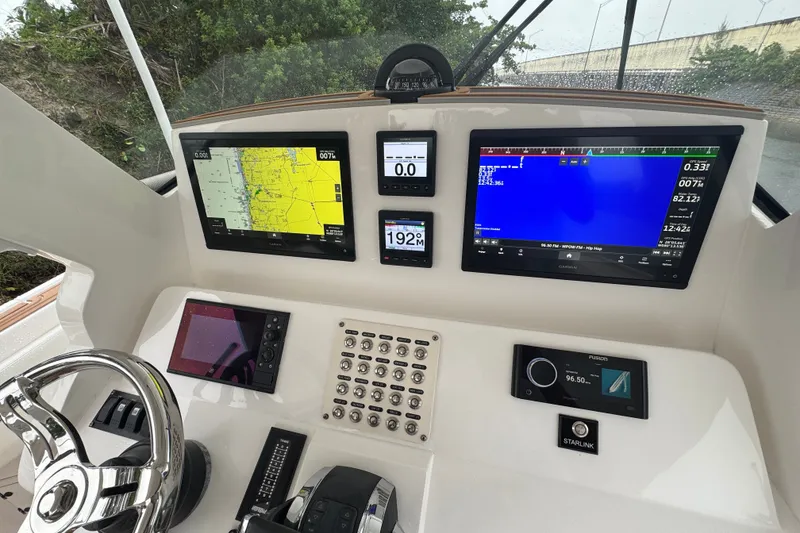 Slide: The Image of Control panel of 2022 Intrepid 345 Nomad SE with navigation screens and steering wheel. - 11