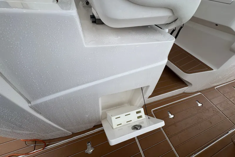 Slide: The Image of 2022 Intrepid 345 Nomad SE boat deck with wet surfaces and seating area. - 24