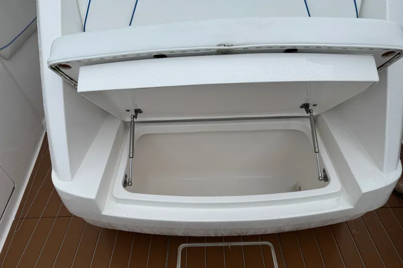 Slide: The Image of Open storage compartment on 2022 Intrepid 345 Nomad SE boat, showcasing interior space. - 40
