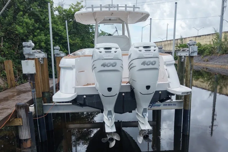 Slide: The Image of Intrepid 345 Nomad SE 2022 with twin 400-horsepower outboard engines on a boat lift. - 5