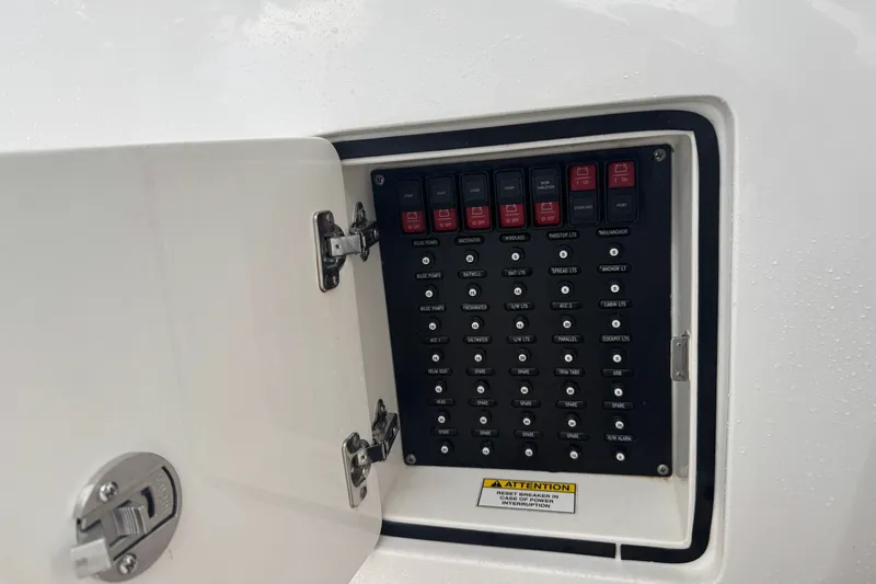 Slide: The Image of Control panel of a 2022 Intrepid 345 Nomad SE boat with labeled switches. - 41