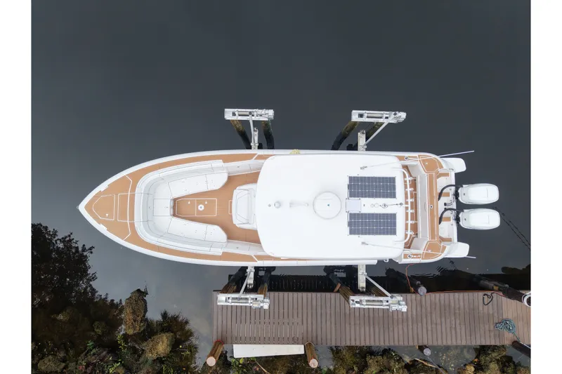 Slide: The Image of Aerial view of a 2022 Intrepid 345 Nomad SE boat at a dock. - 3