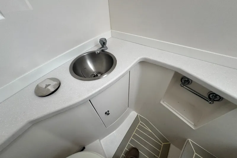 Slide: The Image of Compact bathroom sink area in 2022 Intrepid 345 Nomad SE boat. - 35