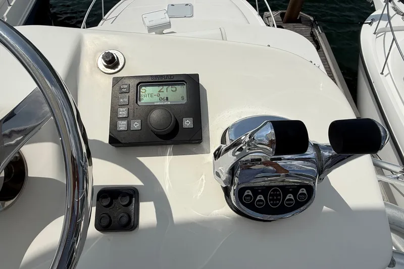 Slide: The Image of Control panel of a 2007 Cabo 32 Express boat with navigation equipment. - 55