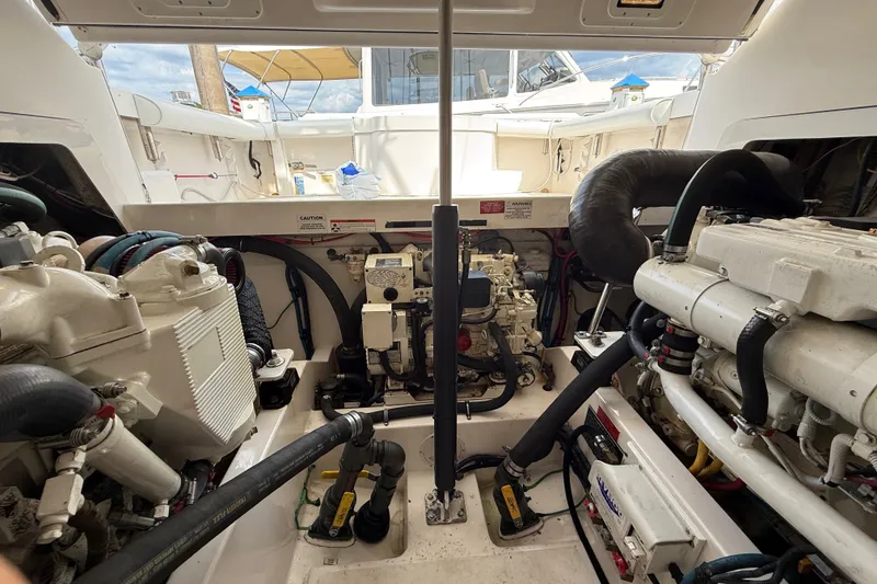 Slide: The Image of Engine room of a 2007 Cabo 32 Express boat, showcasing mechanical components and systems. - 29
