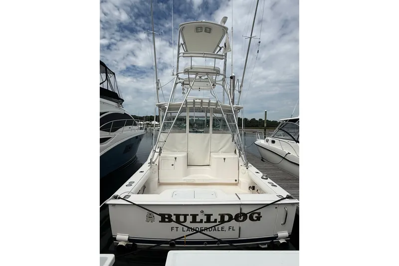 Slide: The Image of 2007 Cabo 32 Express boat docked, rear view, named "Bulldog" in Fort Lauderdale, FL. - 14