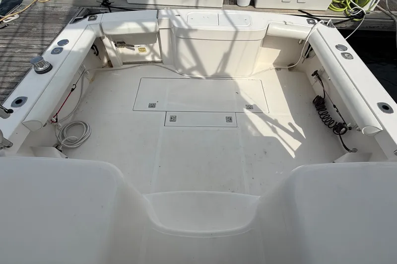 Slide: The Image of The image shows the spacious cockpit of a 2007 Cabo 32 Express boat with white seating. - 20