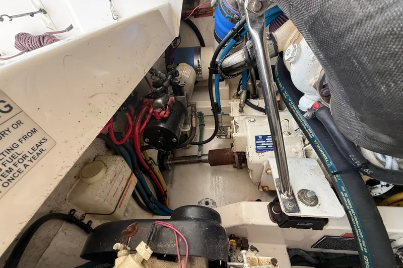Slide: The Image of Engine compartment of a 2007 Cabo 32 Express boat, showing mechanical components and wiring. - 35