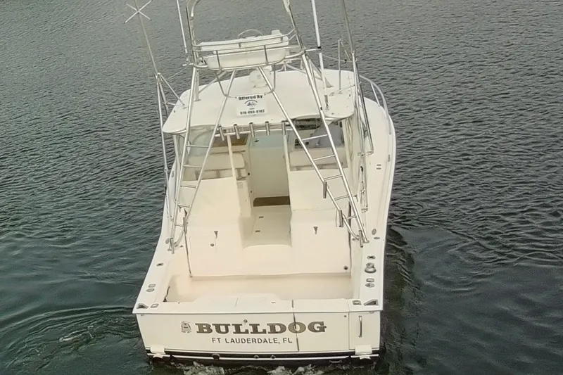 Slide: The Image of 2007 Cabo 32 Express boat named "Bulldog" on water, rear view, Fort Lauderdale, FL. - 5