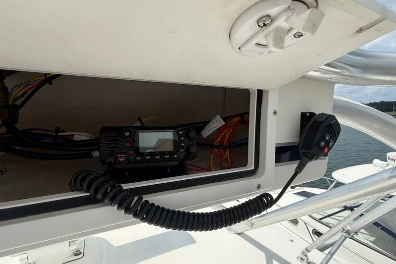 Slide: The Image of 2007 Cabo 32 Express boat radio equipment with coiled microphone cable. - 56
