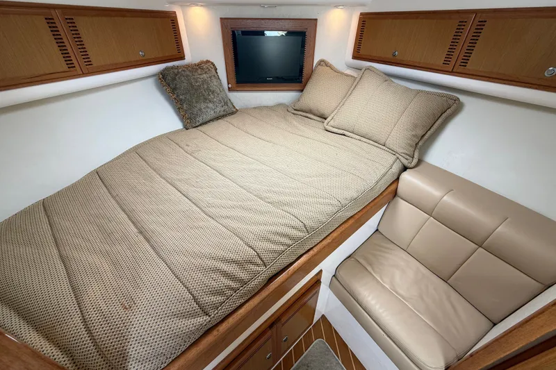 Slide: The Image of Luxurious cabin interior of 2007 Cabo 32 Express with cozy bed and seating. - 63