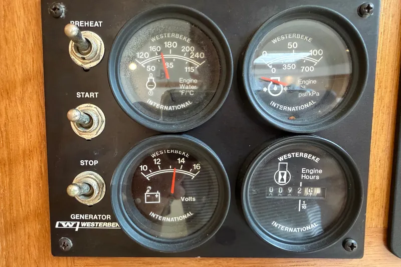 Slide: The Image of Control panel of a 2007 Cabo 32 Express boat with Westerbeke generator gauges. - 72