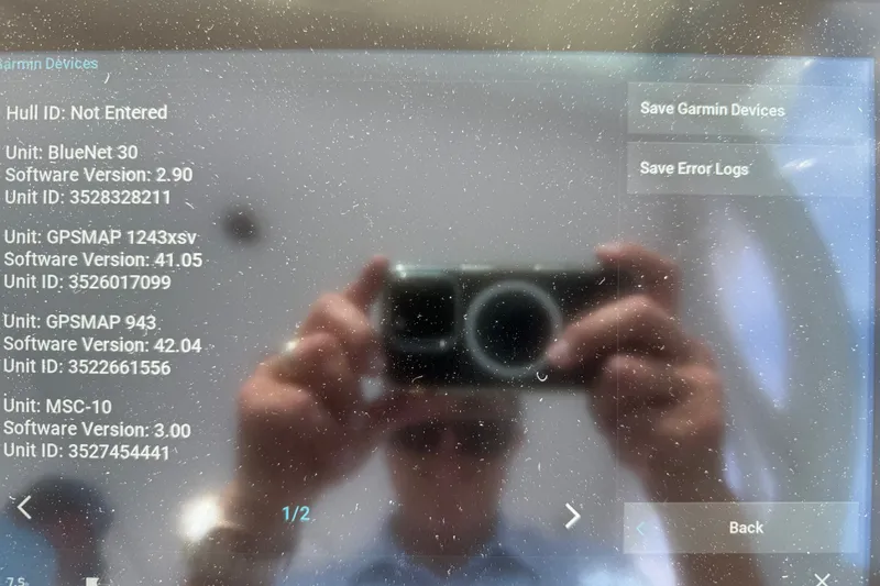 Slide: The Image of Reflection on a screen displaying device information for a 2007 Cabo 32 Express. - 41