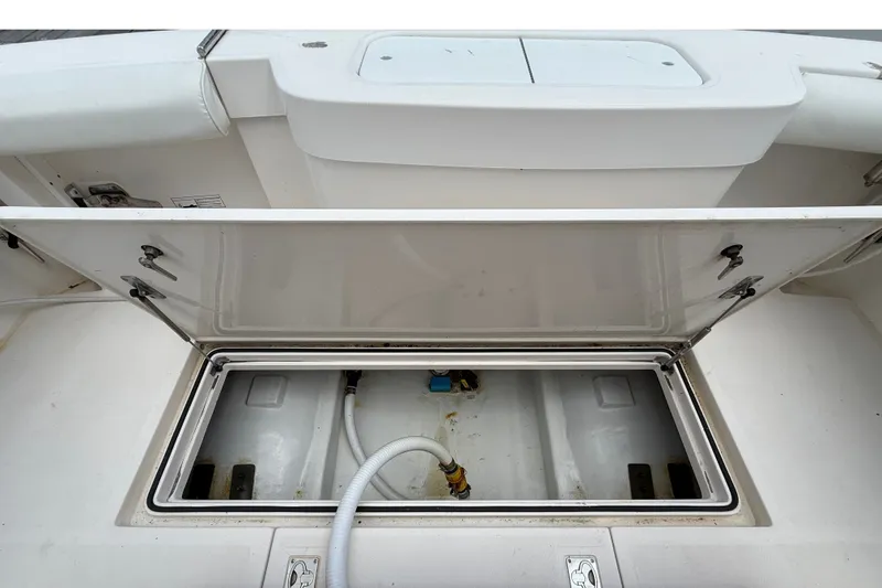 Slide: The Image of Open storage compartment on a 2007 Cabo 32 Express boat. - 23
