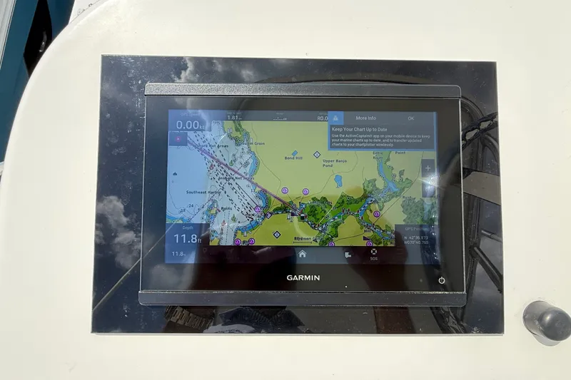 Slide: The Image of Garmin navigation system on a boat with a nautical chart displayed. - 53