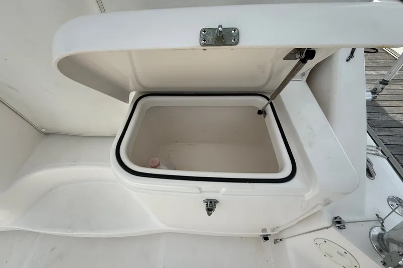 Slide: The Image of Open storage compartment on a 2007 Cabo 32 Express boat deck. - 19
