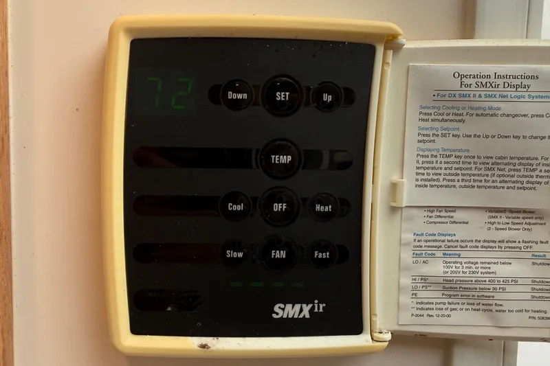 Slide: The Image of SMXir display panel with operation instructions on a 2007 Cabo 32 Express boat. - 73