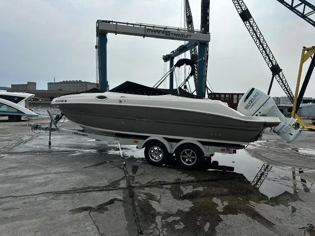 Slide: The Image of A 2021 Stingray 231 boat on a trailer, ready for launch. - 1