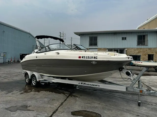 Slide: The Image of A 2021 Stingray 231 boat on a trailer in an industrial area. - 24