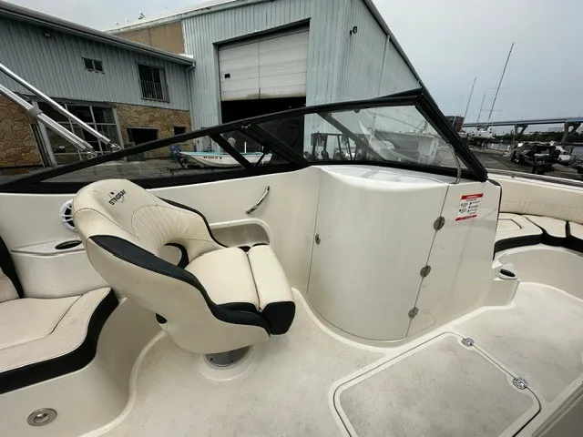 Slide: The Image of The image shows the cockpit of a 2021 Stingray 231 boat with a comfortable seat. - 19