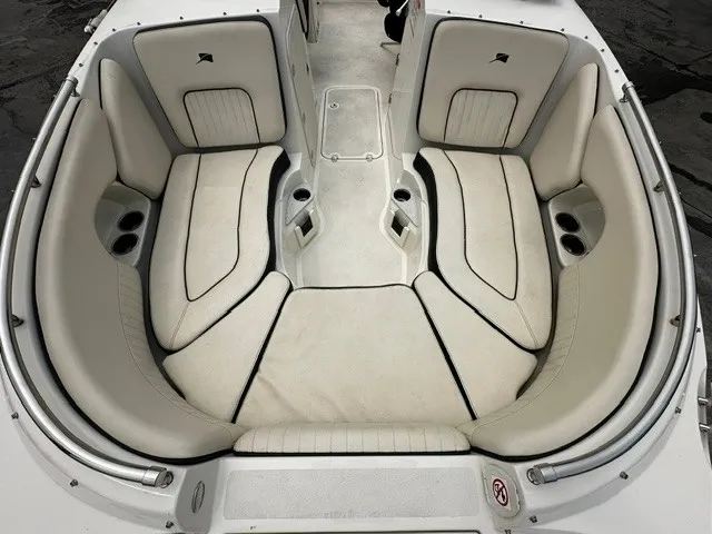 Slide: The Image of The 2021 Stingray 231 features a spacious, cushioned bow area with cup holders. - 13