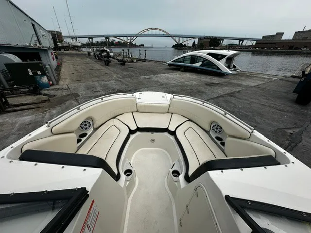 Slide: The Image of The image shows the bow of a Stingray 231 boat with beige seating and speakers. - 10