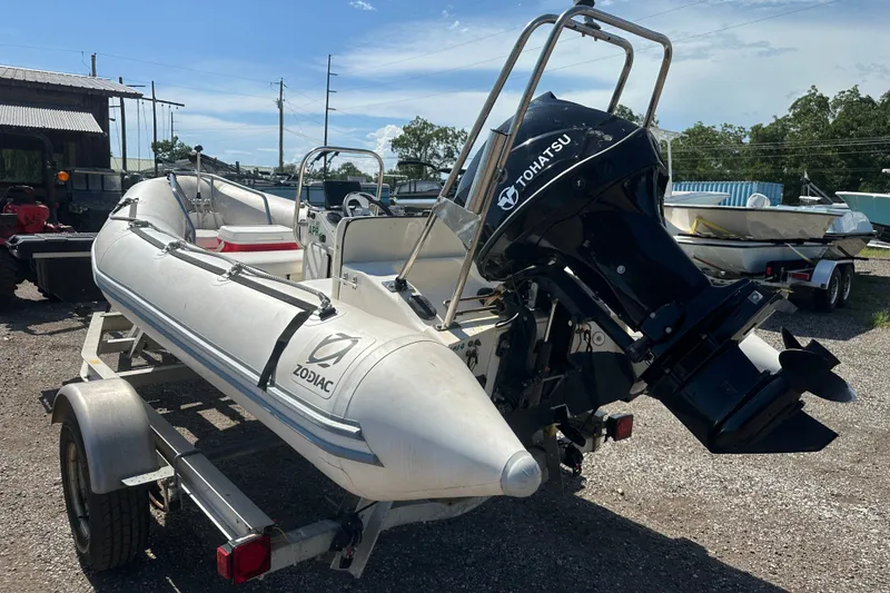 Slide: The Image of 1997 Zodiac Pro 420 inflatable boat with Tohatsu outboard motor on trailer. - 5