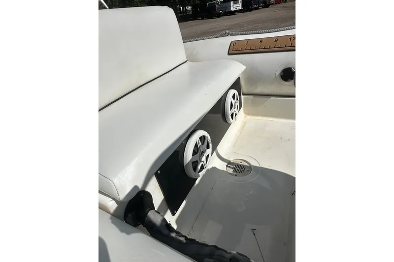Slide: The Image of Interior of a 1997 Zodiac Pro 420 boat showing seating and speakers. - 19